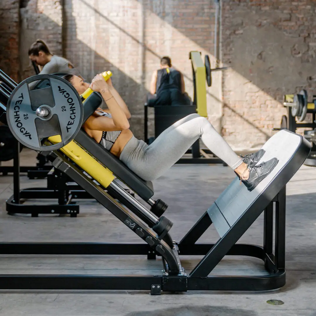 A person is using the leg press machine