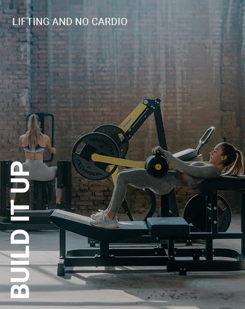 Woman working out on a hip thrust machine.