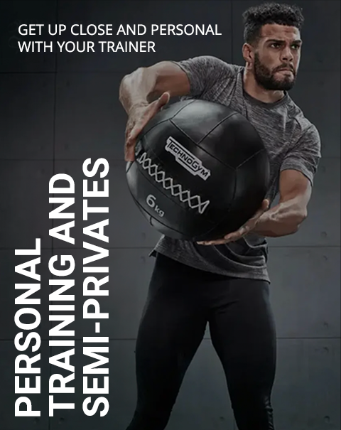 Man lifting a medicine ball during workout.