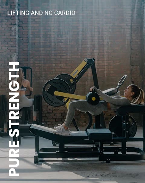 Woman exercising on gym equipment.